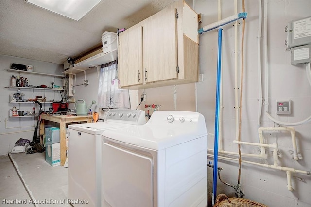 laundry area with cabinets and independent washer and dryer