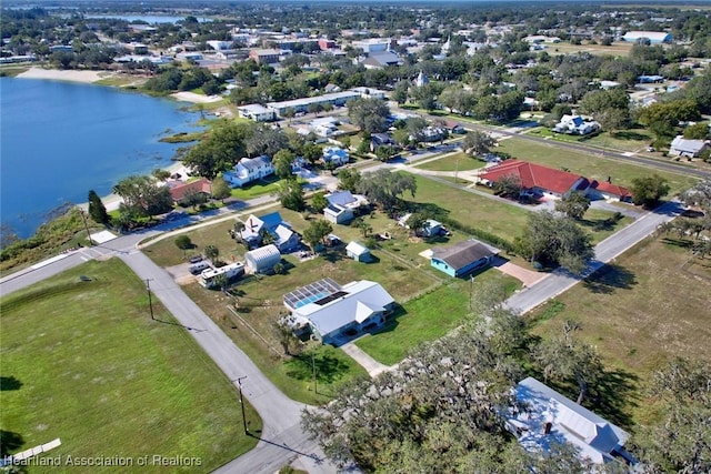 drone / aerial view with a water view