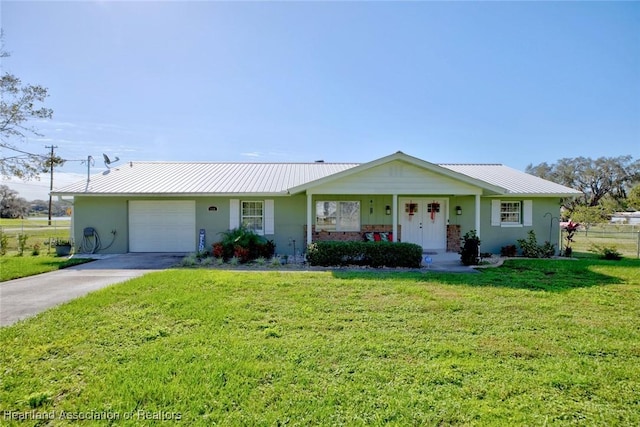 ranch-style home featuring a front yard and a garage