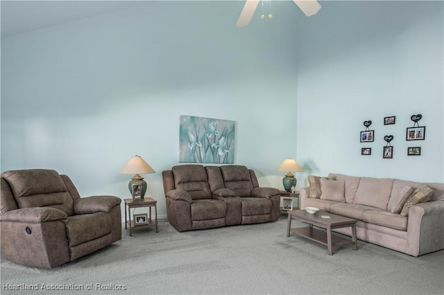 carpeted living room featuring ceiling fan