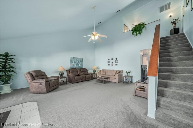 living room featuring carpet floors, high vaulted ceiling, and ceiling fan