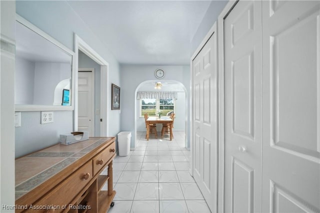 corridor with light tile patterned floors