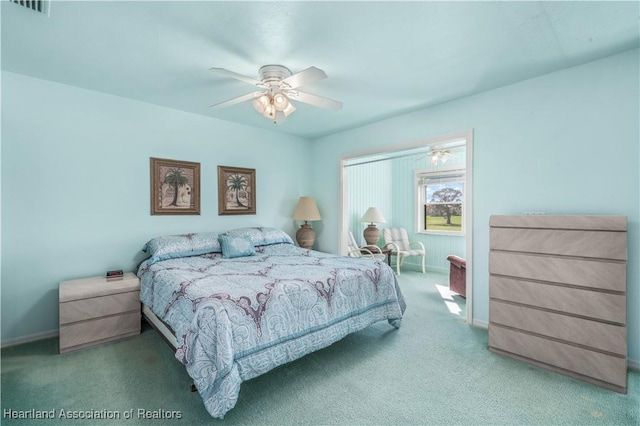 bedroom with ceiling fan and carpet