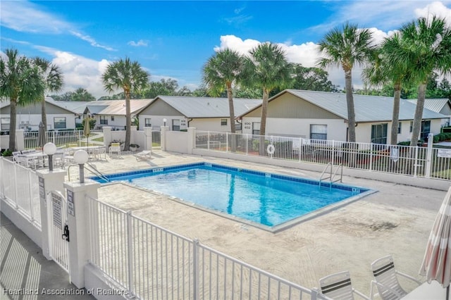 view of swimming pool with a patio