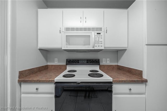 kitchen with white cabinets and white appliances