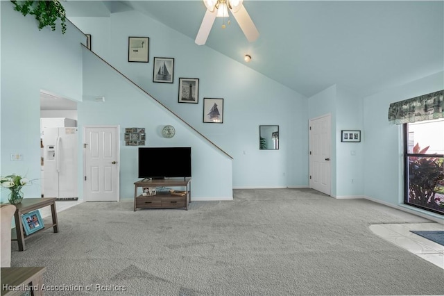 living room with ceiling fan, light carpet, and high vaulted ceiling