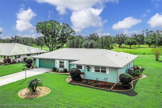 ranch-style home with a garage and a front lawn