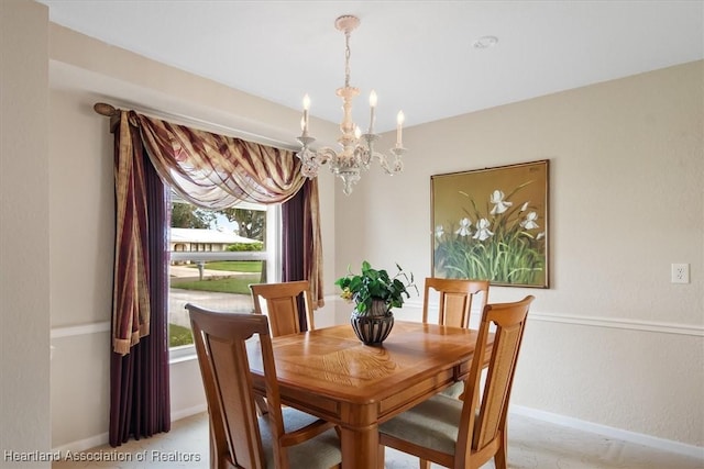 dining space featuring a notable chandelier