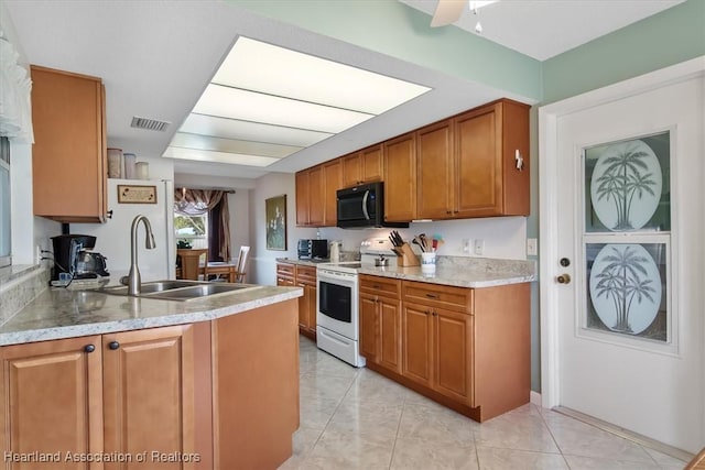 kitchen with white range with electric cooktop, ceiling fan, sink, and light tile patterned flooring