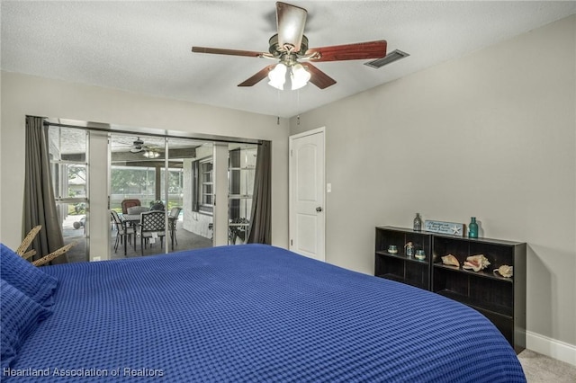 carpeted bedroom featuring visible vents, baseboards, ceiling fan, access to outside, and a textured ceiling