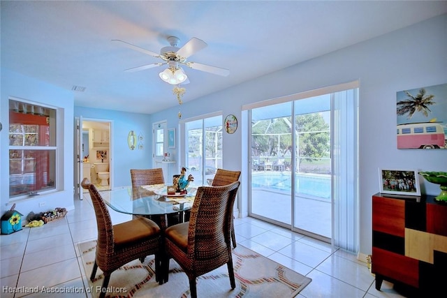 dining room with ceiling fan and light tile patterned floors