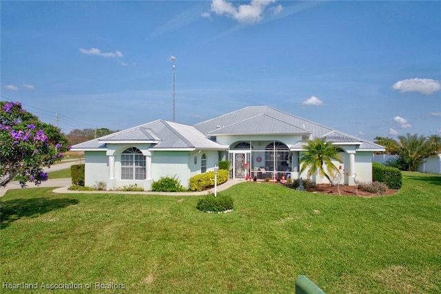 ranch-style home featuring a front yard