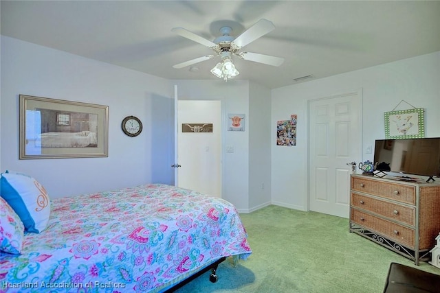 carpeted bedroom featuring ceiling fan