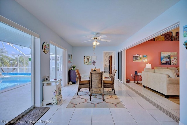 tiled dining room featuring ceiling fan