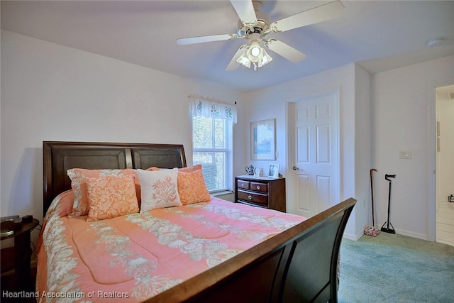 bedroom featuring ceiling fan and light carpet