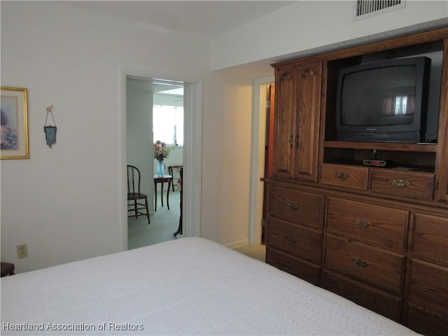 carpeted bedroom with visible vents