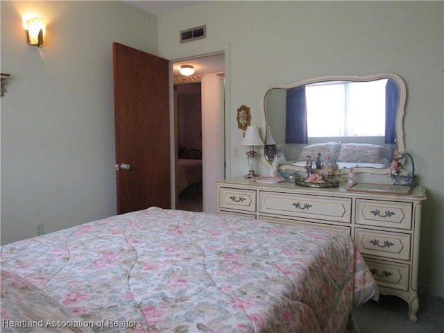 bedroom with visible vents