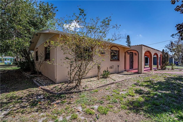 mediterranean / spanish-style house with stucco siding