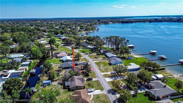 bird's eye view featuring a water view and a residential view