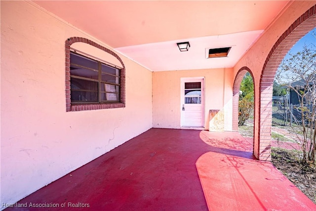 view of patio featuring fence