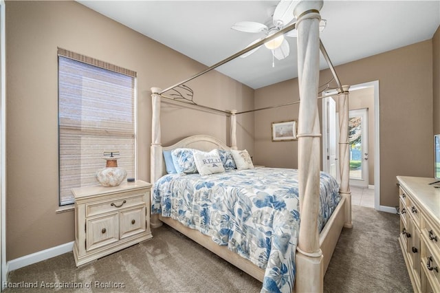 bedroom featuring dark carpet and ceiling fan