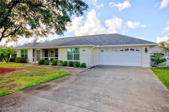 ranch-style house with a front yard and a garage