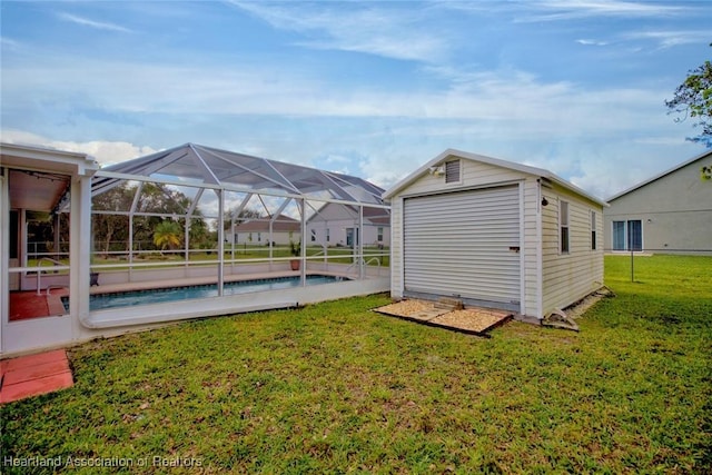 exterior space with glass enclosure and an outbuilding