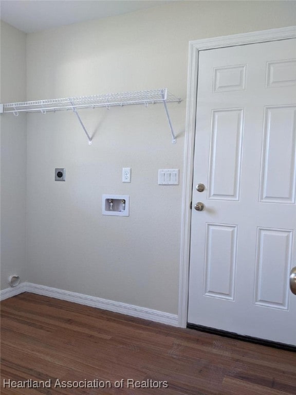 laundry area featuring baseboards, laundry area, hookup for an electric dryer, and dark wood-style flooring