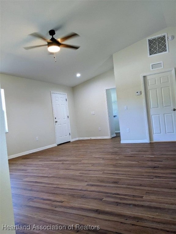 unfurnished room featuring visible vents, baseboards, ceiling fan, and dark wood-style flooring