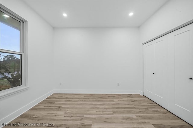 interior space with light hardwood / wood-style floors and a closet