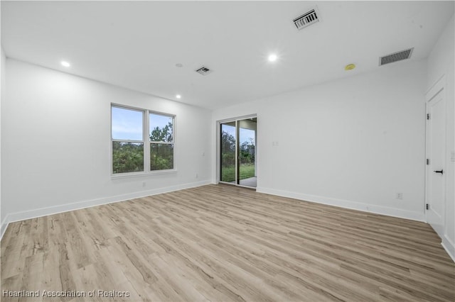 unfurnished room featuring light hardwood / wood-style flooring