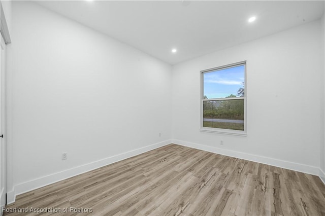 unfurnished room with light hardwood / wood-style flooring