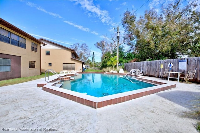 view of pool featuring a patio