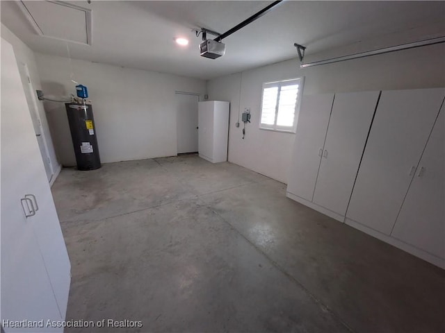 garage with water heater and a garage door opener