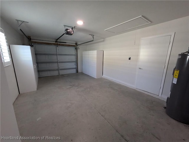 garage featuring water heater and a garage door opener