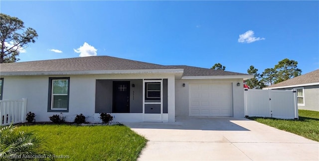 single story home with a front yard and a garage