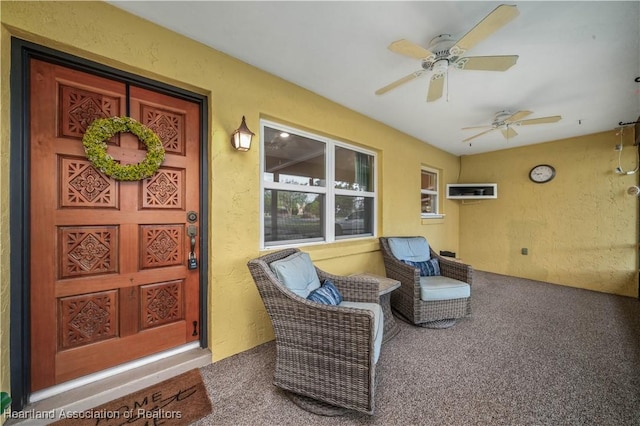 doorway to property featuring ceiling fan