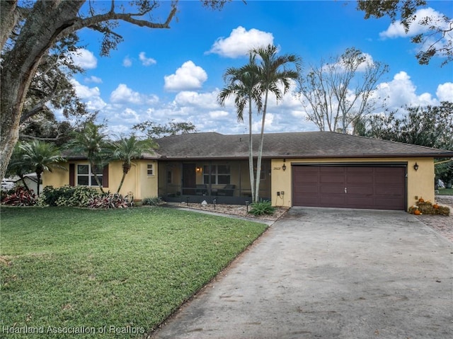 ranch-style house with a front yard and a garage