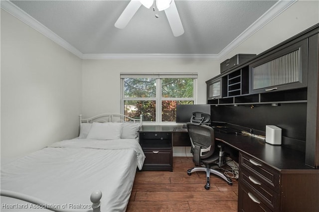 bedroom with a textured ceiling, crown molding, ceiling fan, and dark wood-type flooring