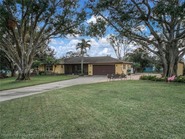 ranch-style house with a garage and a front yard