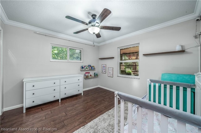 bedroom featuring a textured ceiling, dark hardwood / wood-style flooring, ceiling fan, and ornamental molding