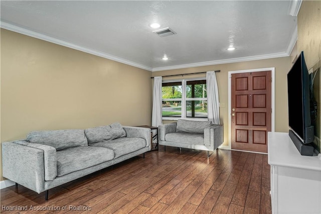 living room with dark hardwood / wood-style flooring and ornamental molding