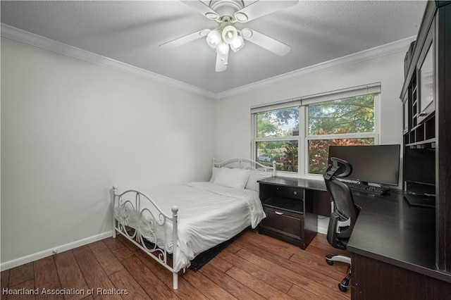 bedroom featuring ceiling fan, crown molding, wood-type flooring, and a textured ceiling