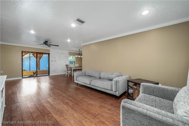 living room with ceiling fan, wood-type flooring, and ornamental molding