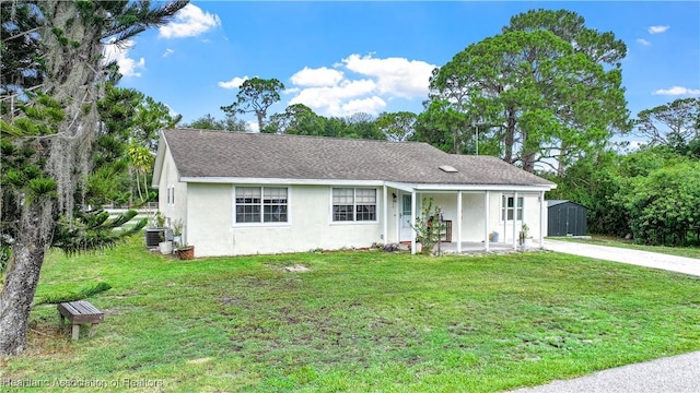 513 Serenade Ter, Lake Placid, FL 33852 - ranch-style home featuring stucco siding, a front yard, a porch, and central AC