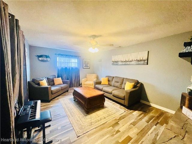 300 Whatley Blvd, Sebring, FL 33870 - living area featuring a ceiling fan, wood finished floors, baseboards, and a textured ceiling