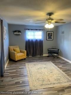 300 Whatley Blvd, Sebring, FL 33870 - living area with ceiling fan and wood finished floors