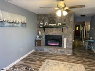 300 Whatley Blvd, Sebring, FL 33870 - living room with ceiling fan, wood finished floors, and a fireplace