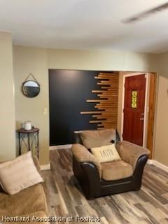 300 Whatley Blvd, Sebring, FL 33870 - living room featuring dark wood-style floors and baseboards