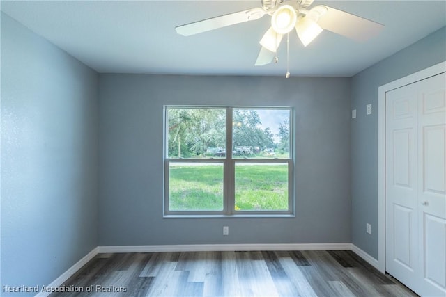 spare room featuring ceiling fan and wood-type flooring